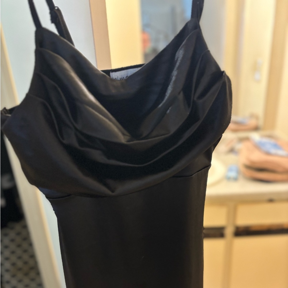 Black sleek cocktail dress. Form fitting